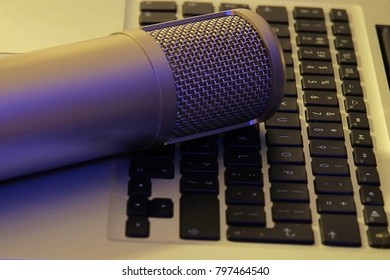 Podcast Microphone On A Laptop Keyboard Media Business Creative