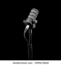 Podcast microphone on a tripod, a black metal dynamic microphone on an isolated black background, for recording podcast or radio program, show, sound and audio equipment, technology, product photo, dj