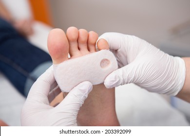 podiatrist ( chiropodist ) cleaning womans feet
