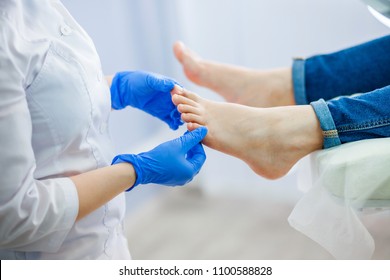 Podiatry doctor examines the foot