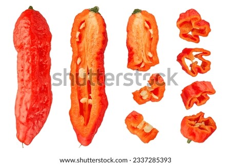 Pods of fresh habanero peppers on a white isolated background. Ripe red habanero pepper cut into different slices, lengthwise and across on a white background. Close-up, high quality photo.