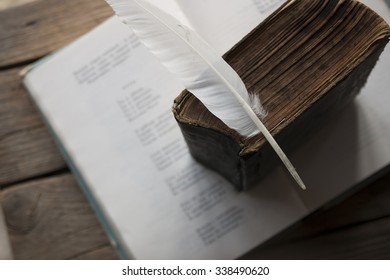 Poet, Writer, Literature Idea. Old Book, Book Of Poems And A Feather.