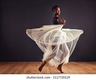 Poetry in motion. Young female contemporary dancer using a soft white white skirt for dramatic effect. - Powered by Shutterstock