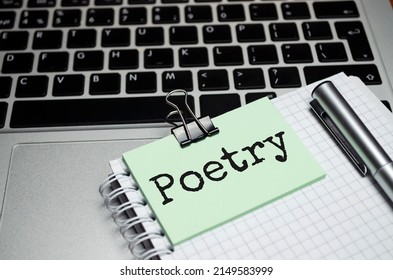 Poetry Words On The Paper, Magnifier Laptop And Pen