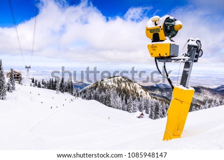 Poiana Brasov, Romania - Snow cannon on ski slopes resort in Carpathian Mountains.