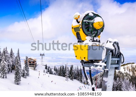 Poiana Brasov, Romania - Snow cannon on ski slopes resort in Carpathian Mountains.