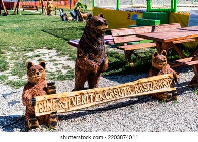 POIENARI, GORJ, ROMANIA - AUGUST 04, 2022: Wood Bears In The Garden Of The Overturned House, Unique In Romania.