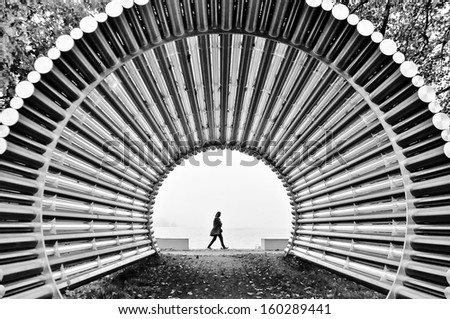 Similar – Man walking along the jetty