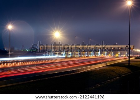 Point of acceptance of payments on the carriageway. Busy toll road, with many cars queuing up to pay tolls. Stock photo © 