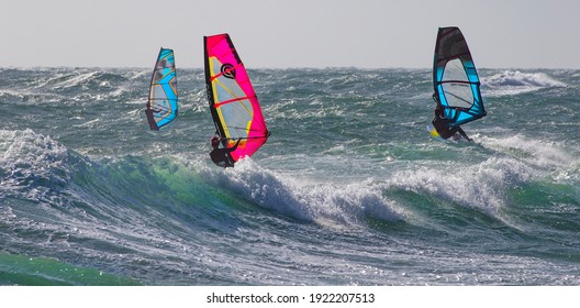 Point de Carro, France - February 21, 2021: windsurfers enjoy windy winter day at Mediterranean Sea 