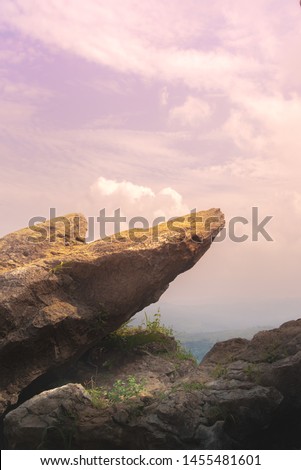 Point Edge of Cliff King Rock on Stone Garden at The Very Top of Mountain During Pink Sunrise or Sunset