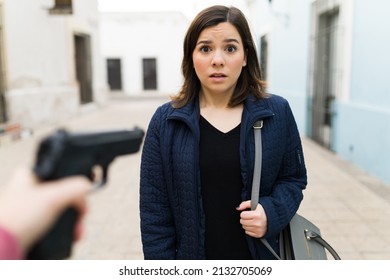 Point Of View Of A Beautiful Woman Looking Scared While Being Robbed And Threatened With A Gun By A Thief