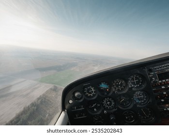 Point of view: piloting small aircraft. Cockpit of light utility aircraft - instrument panel with numerous gauges.  - Powered by Shutterstock