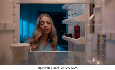 Point of view POV inside refrigerator Caucasian girl hungry woman open fridge at home kitchen look at empty shelves order food products delivery with mobile phone app online service web store shopping - Powered by Shutterstock