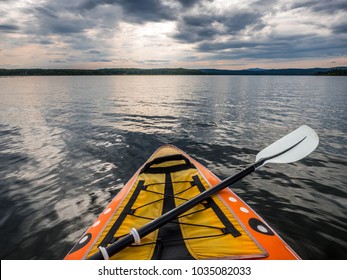 Point Of View Shot From Inside Kayak On Lake Water.