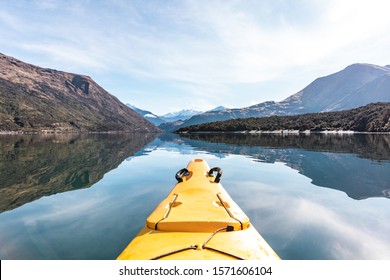 A Point Of View Shot Of A Yellow Kayak Boat Sailing In Beautiful Lake Wanaka, New Zealand