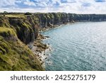 Pointe du Hoc Cliff. Pointe du Hoc s a promontory with a 100 ft (30 m) cliff overlooking the English Channel on the coast of Normandy in northern France. 