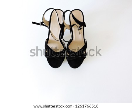  Pointed female shoes with high heels isolated on a white background. Photos of women's shoes with platform,Elegant expensive black high heel women shoes.Top view of new pair of black stylish shoes.
