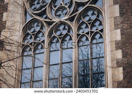 Pointed gothic windows with stained glass on facade of the building. Gothic architecture. Church of St. Olga and Elizabeth. Lviv, Ukraine. Stock photo © 