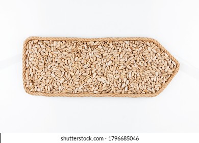 Pointer made of rope filled with refined sunflower seeds. Isolated on white background