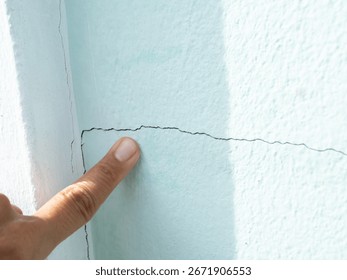 Pointing Crack wall texture background broken earthquake effect, whtie grey building cement damage pattern plaster grunge black line paint surface abstract, construction rough street concrete