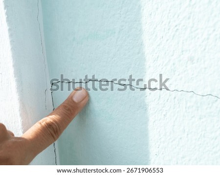 Pointing Crack wall texture background broken earthquake effect, whtie grey building cement damage pattern plaster grunge black line paint surface abstract, construction rough street concrete