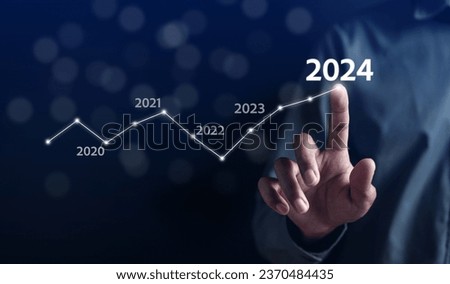 Pointing Happy New year 2024 with chart graph and countdown merry christmas and happy new year, Planning and challenge strategy business in new year 2024 Concept.