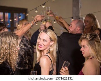 Pointing Mature Woman At A Party Or Reception Being Silly