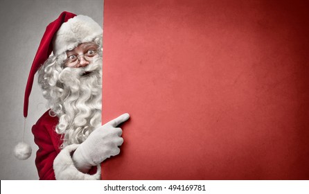 Pointing at a red cardboard - Powered by Shutterstock