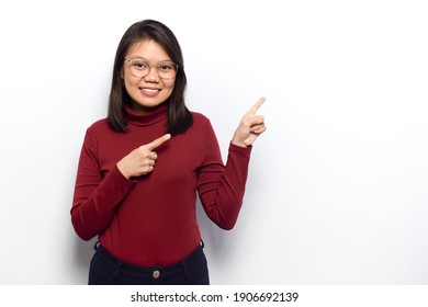 Pointing Right And Showing Blank Copy Space Of Young Beautiful Asian Women Dress Red Shirt Isolated On White Background