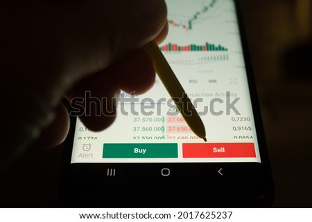 pointing sell button. forex or stock market or cryptocurrency. investing or trading