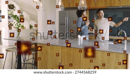 Pointing two men standing behind marble island in kitchen, displaying floating icons, copy space. Friends, casual, openplan, modern, plants, augmentedreality, socialmedia