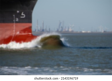 Pointy Bottom Cargo Ship Tip And Blue Sea In Blurry View