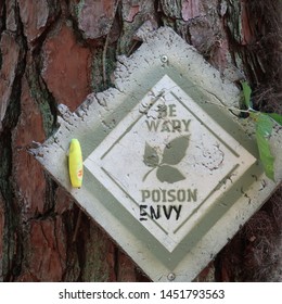 Poison Ivy And Envy Sign In The Woods