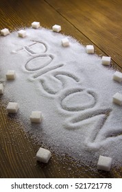 POISON Written On Sugar On Brown Wooden Table. Health Concept