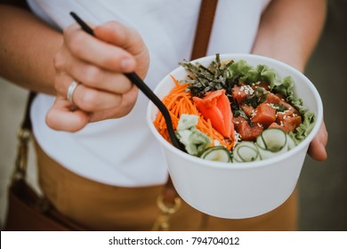 Poke bowl - raw fish salad served as an appetizer, Hawaiian cuisine - Shutterstock ID 794704012