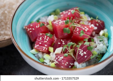 Poke bowl with tuna fillet and white rice, selective focus, close-up, horizontal shot