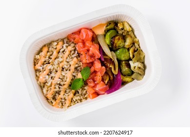 Poke With Brown Rice, Salmon And Grilled Vegetables In A Plastic Takeout Container