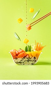 Poke sushi bowl with salmon. Food cut in half. Levitation photo - Shutterstock ID 1993905683