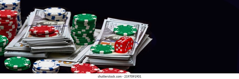 Poker cards royal flush, cash money dollar bills. Gambling, casino chips, dices. Casino tokens, gaming chips, checks, or cheques on green table in casino club.
