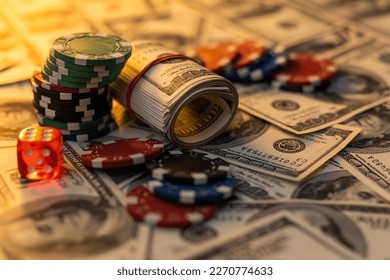 Poker cards royal flush, cash money dollar bills. Gambling, casino chips, dices. Casino tokens, gaming chips, checks, or cheques on green table in casino club