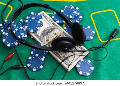 Poker cards royal flush, cash money dollar bills. Gambling, casino chips, dices. Casino tokens, gaming chips, checks, or cheques on green table in casino club. - Powered by Shutterstock