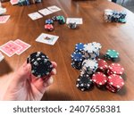 poker chips and cards on green felt table, representing risk, strategy, and fortune in a casino setting