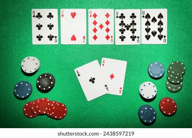 Poker chips and cards on green table - Powered by Shutterstock