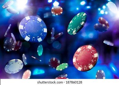 Poker Chips falling with dramatic lighting