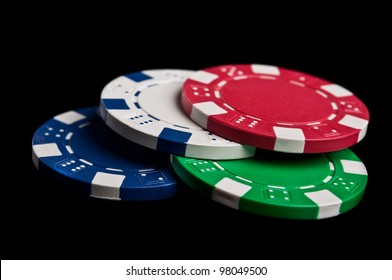 Poker Chips Isolated On A Black Background