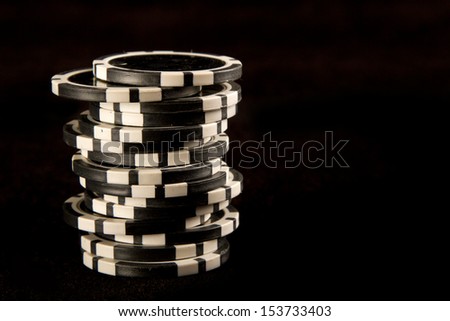 Poker chips on black background