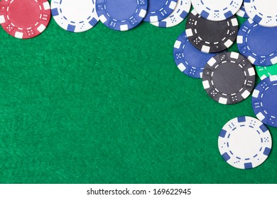 poker chips on a green casino table background