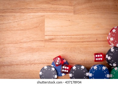 Poker Chips Over Old Wooden Table. Group Of Different Poker Chips. Casino Background.