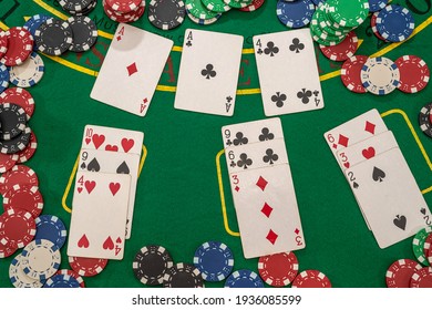 poker chips  with play cards on the green casino table. gambling